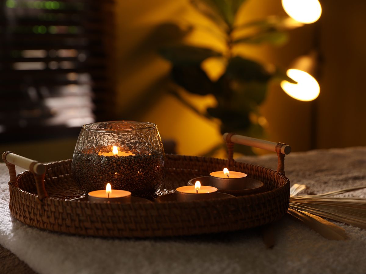 Candlelight and warm towels in a treatment room