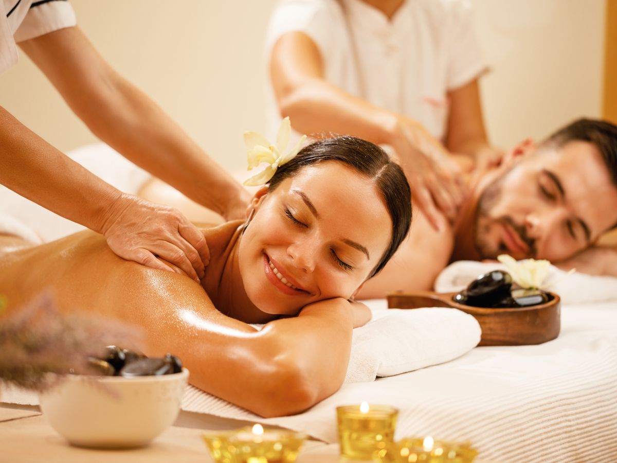A couple enjoying a side-by-side massage